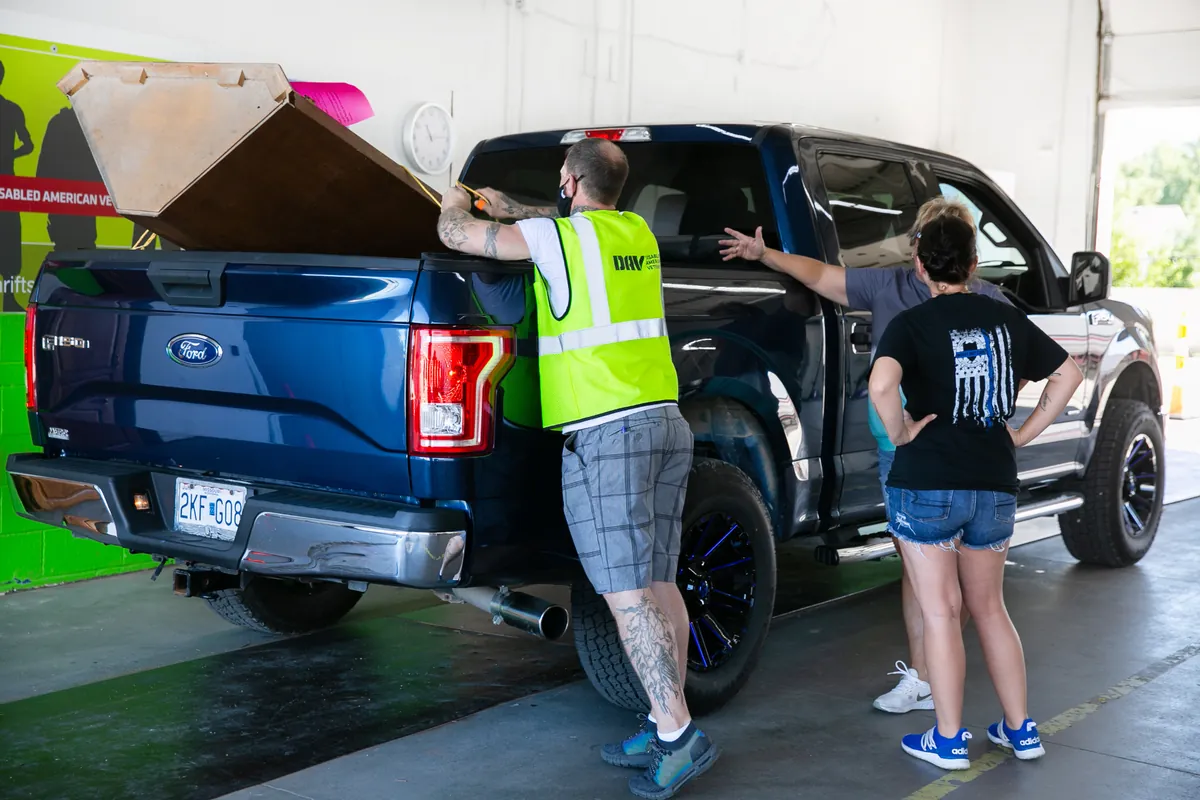 DAV team member unloading donations from truck