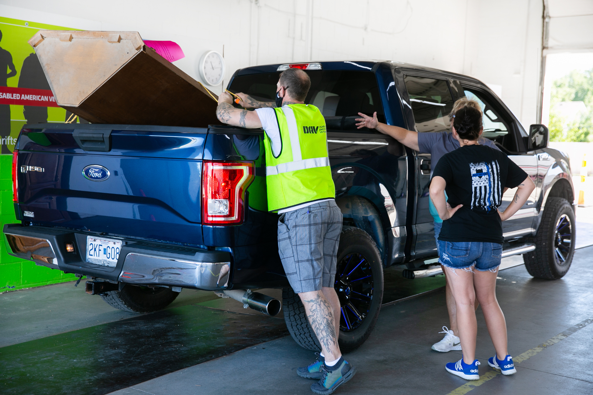 DAV team member unloading donations from truck