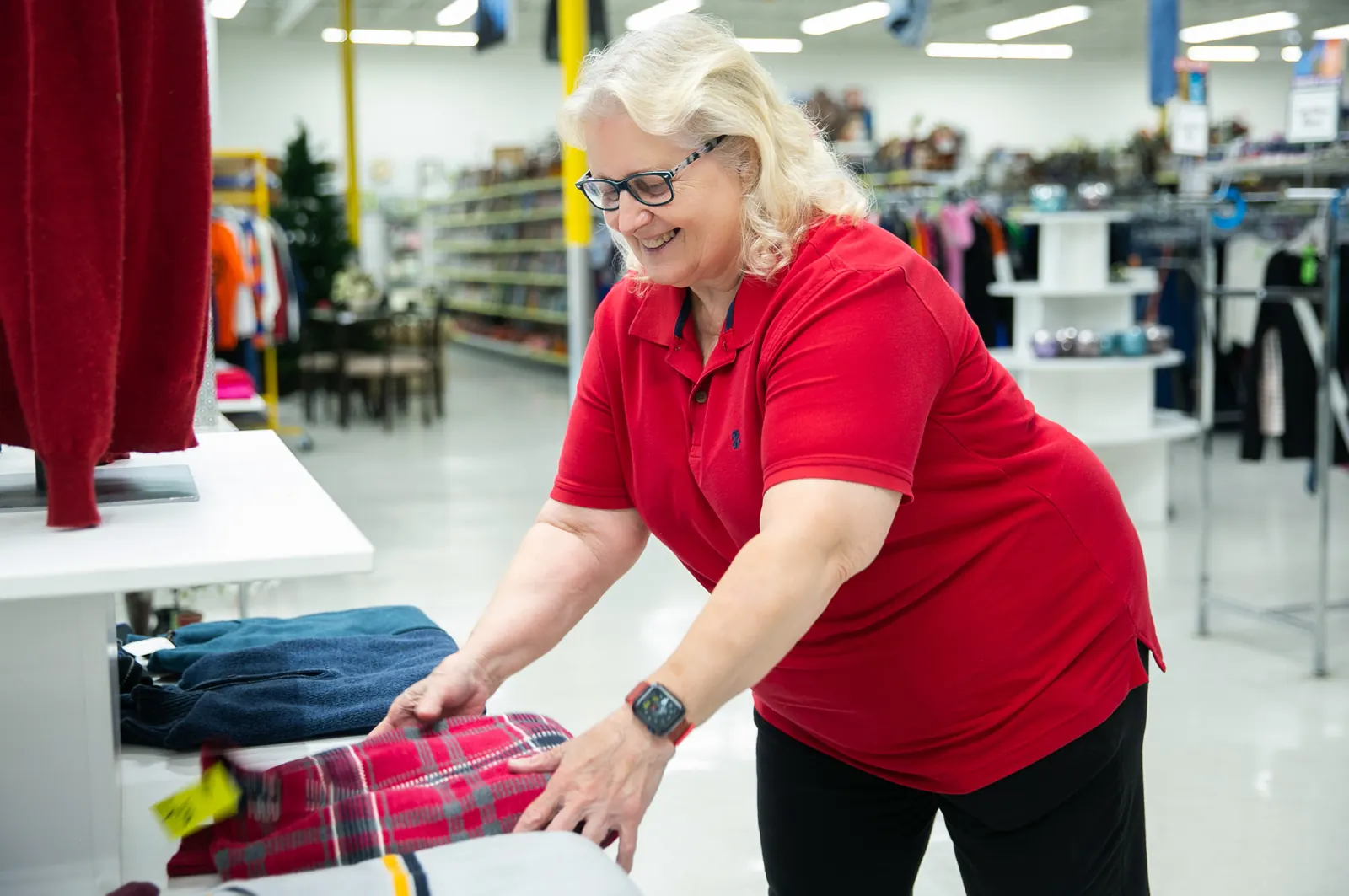 Red Racks team members working together on the store floor