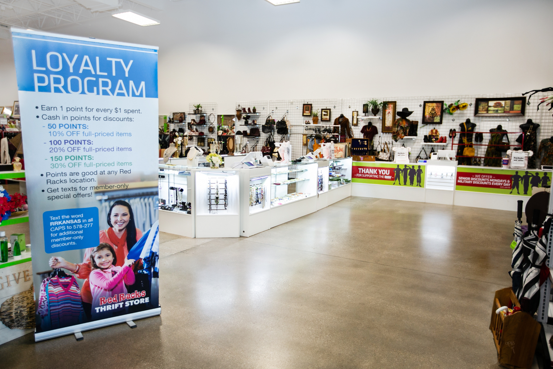 Jewelry and accessories counter with loyalty program sign